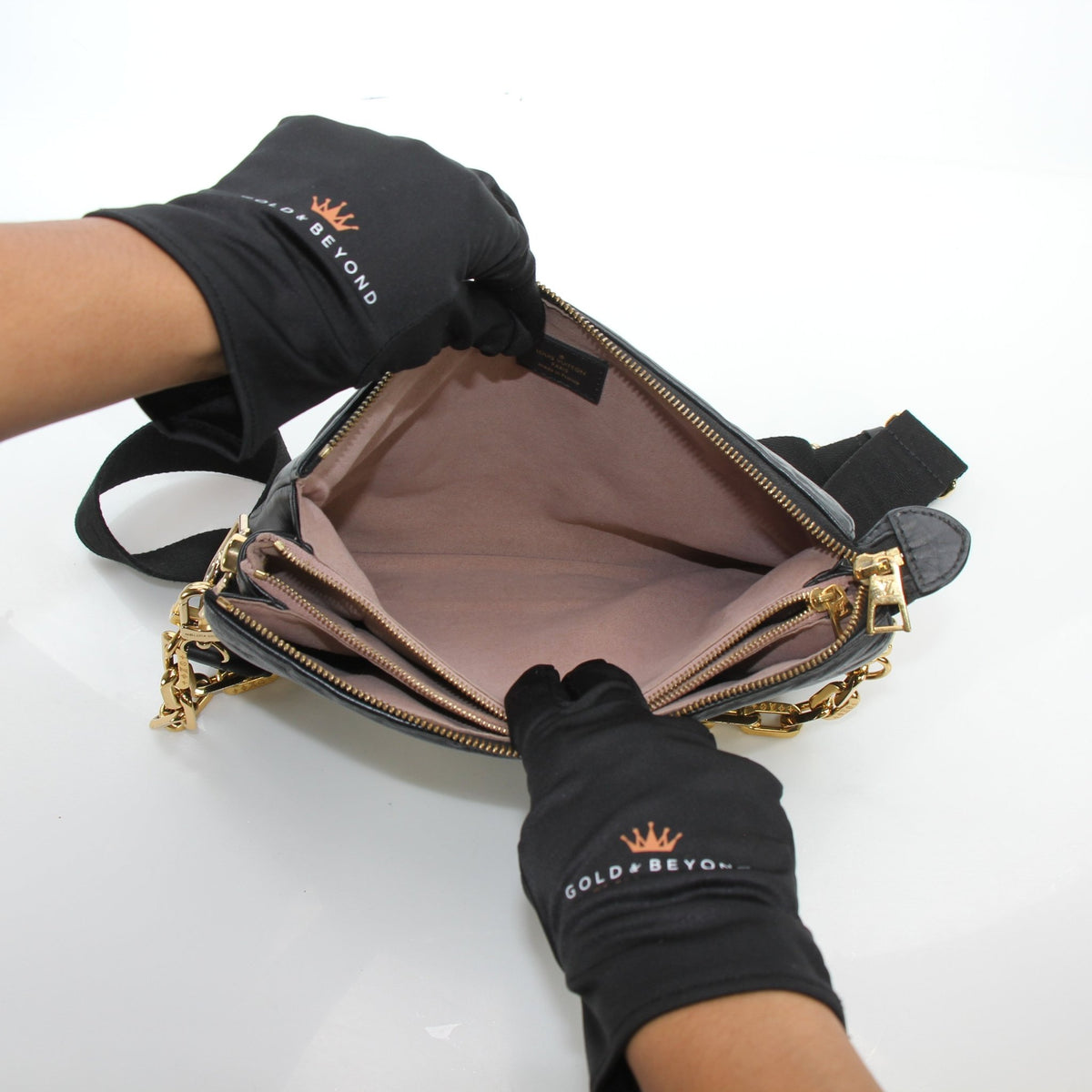 Louis Vuitton Black Coussin PM handbag by Gold & Beyond, showing the soft leather handbag with gold-tone hardware and strap details.