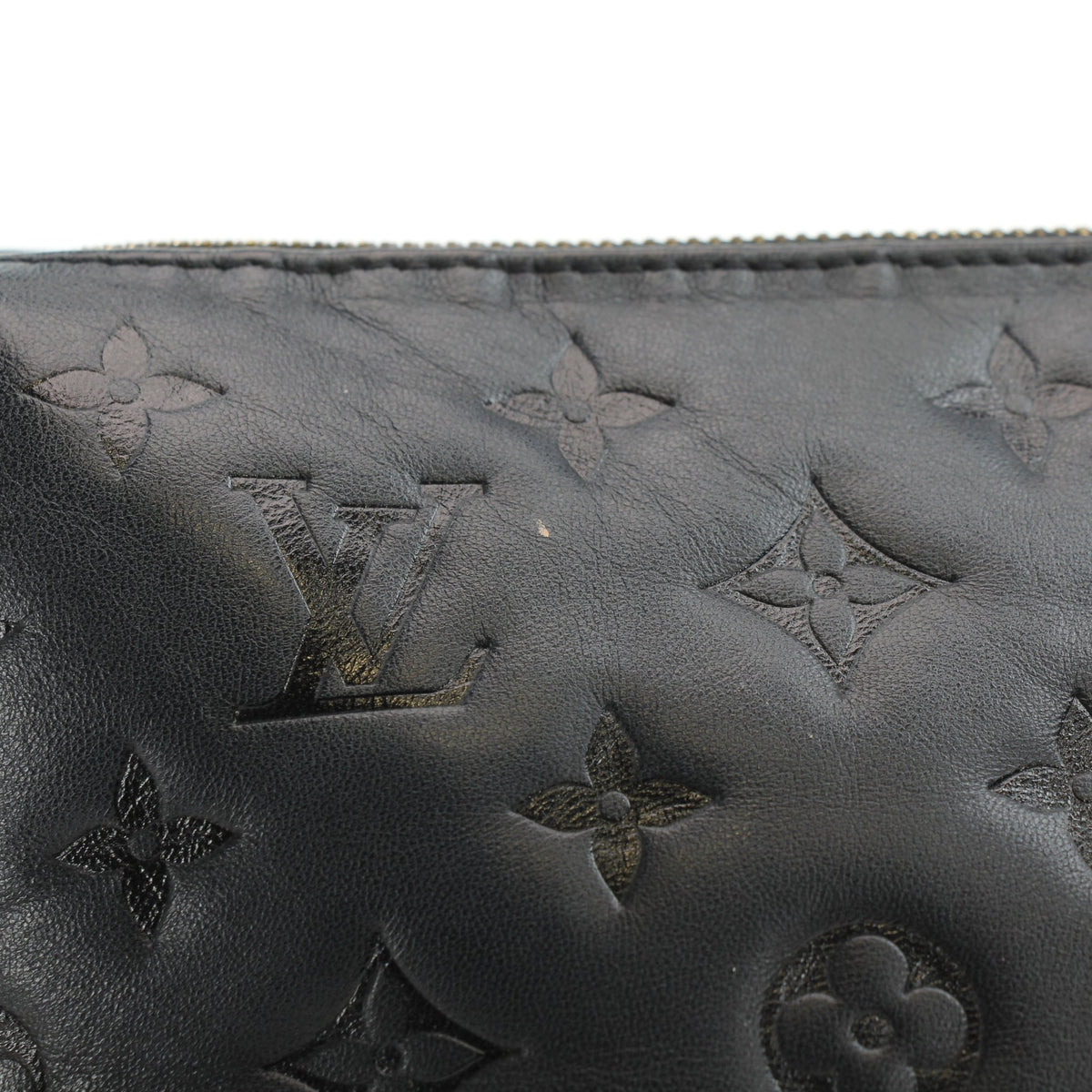 Louis Vuitton Black Coussin PM handbag with gold hardware, featuring soft quilted leather and a top handle.
