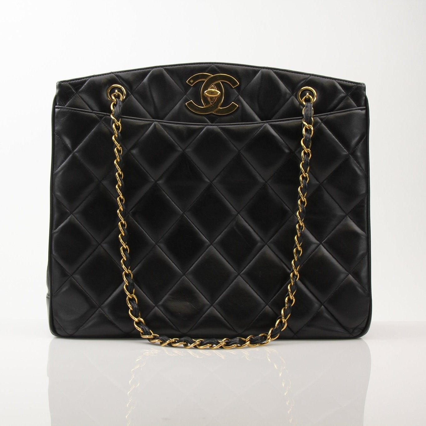 Chanel Black Metalasse Lambskin 2-Way Shoulder Bag with silver hardware, featuring a sleek design and chain strap detail.