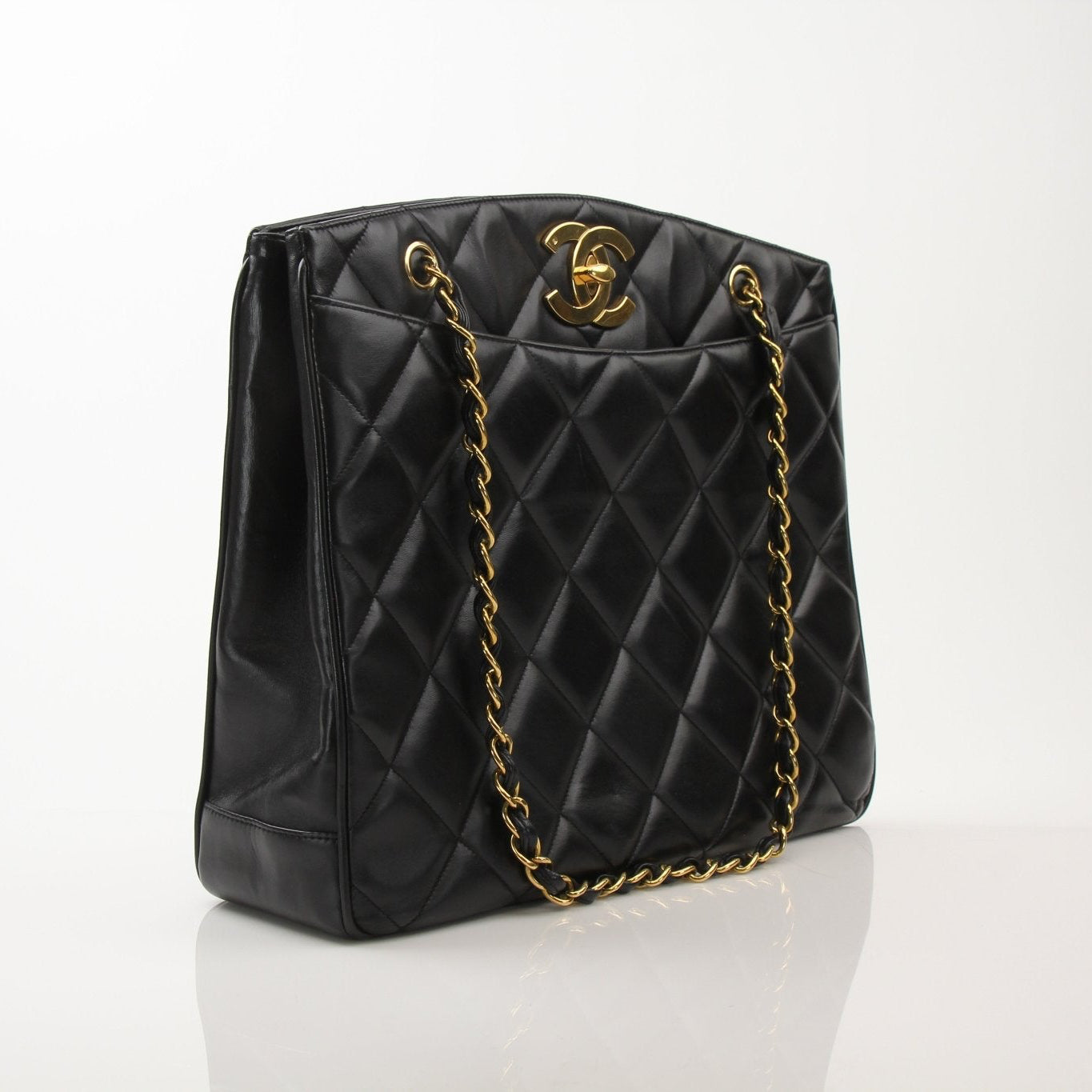 Chanel black metalasse lambskin 2-way shoulder handbag with gold hardware, featuring a sleek, luxurious design and versatile style.