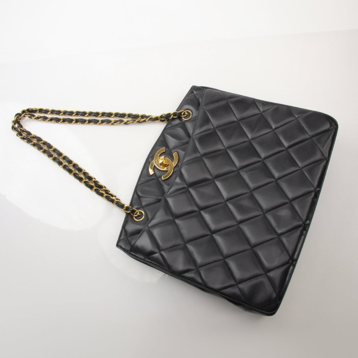 Chanel Black Metalasse Lambskin 2-Way Shoulder Bag with silver hardware, featuring a sleek design and chain strap.
