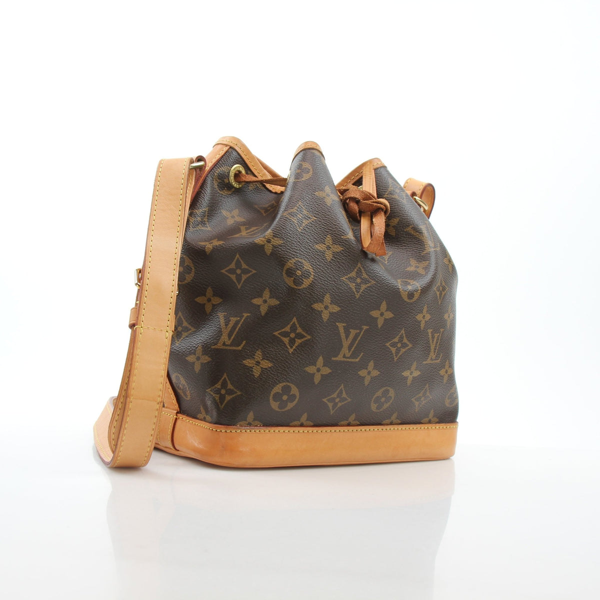 Louis Vuitton Noé BB Monogram Bucket Bag in classic monogram canvas, featuring a drawstring closure and leather accents.