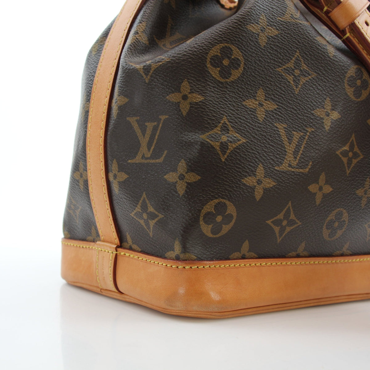 Louis Vuitton Noé BB Monogram Bucket Bag, gold hardware, leather drawstring closure, and monogram canvas, stylish handbag.
