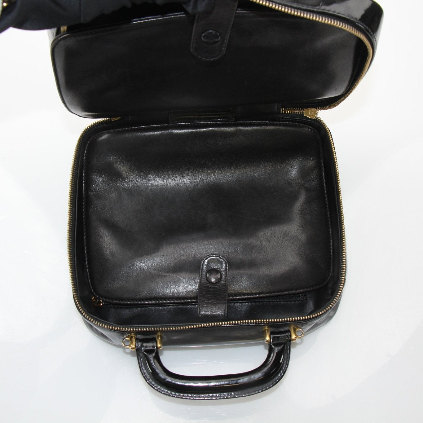 Gold & Beyond Chanel Coco Mark patent 2-way handbag with gold hardware and signature quilting, showing its elegant design and structure.