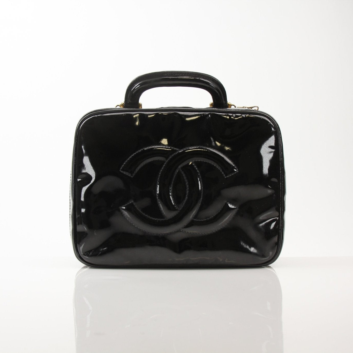 Gold & Beyond Chanel Coco Mark patent 2-way handbag with top handle and sleek design, featuring iconic logo accents.