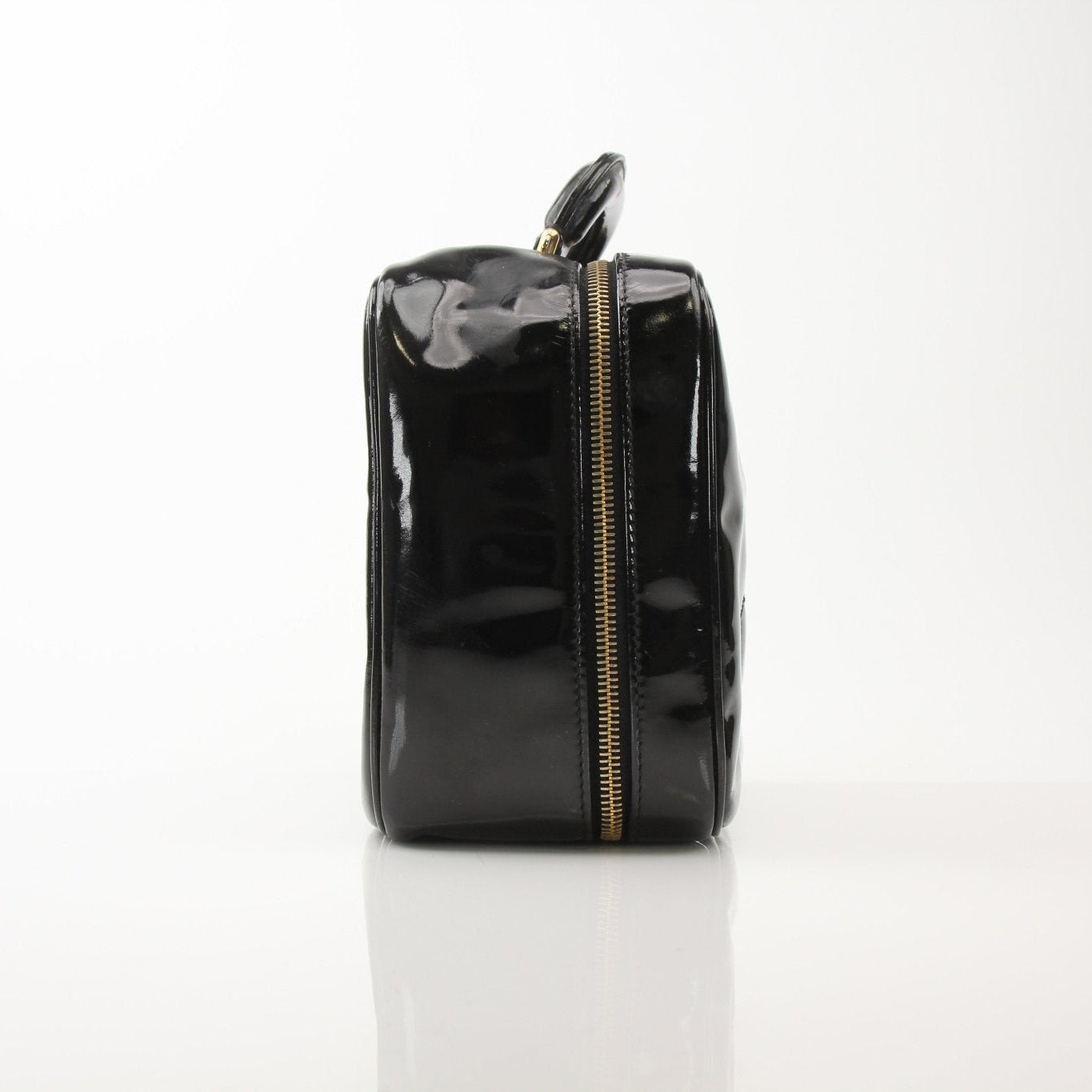 Gold & Beyond Chanel Coco Mark patent 2-way handbag with gold hardware and signature quilted design.