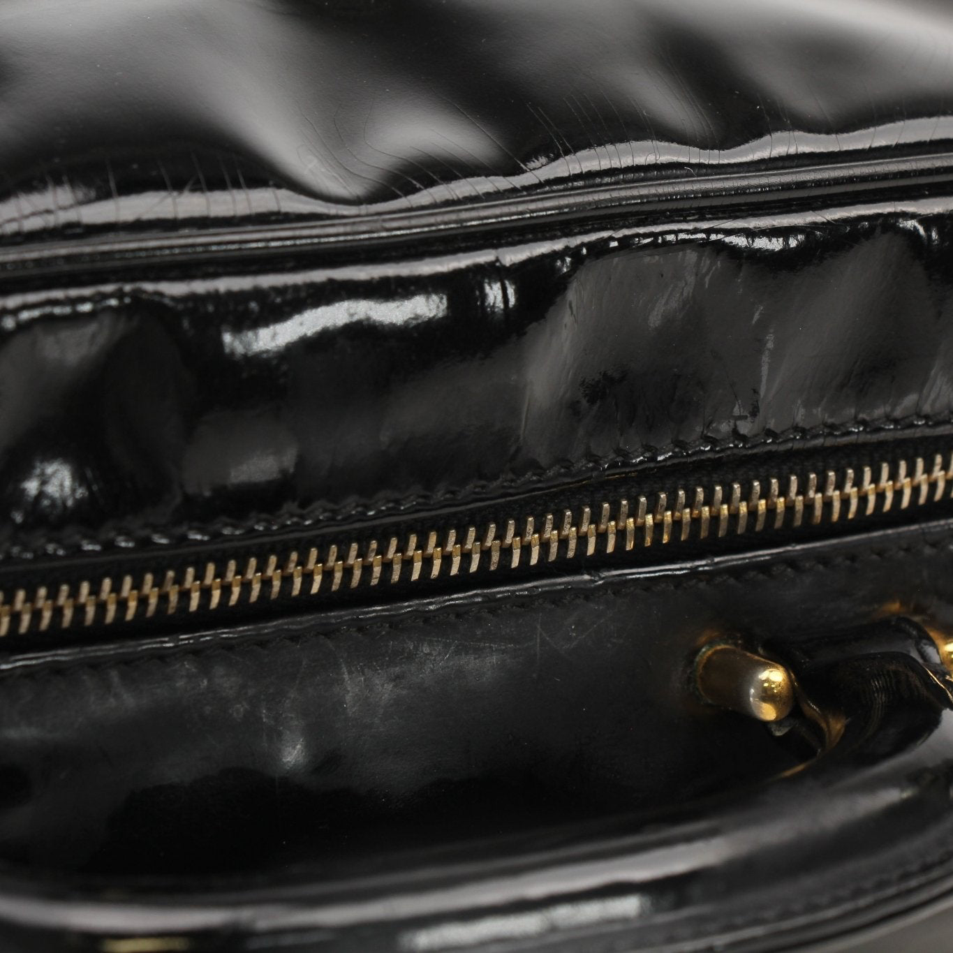 Gold & Beyond Chanel Coco Mark patent 2-way handbag with gold hardware, featuring a quilted design and chain strap.