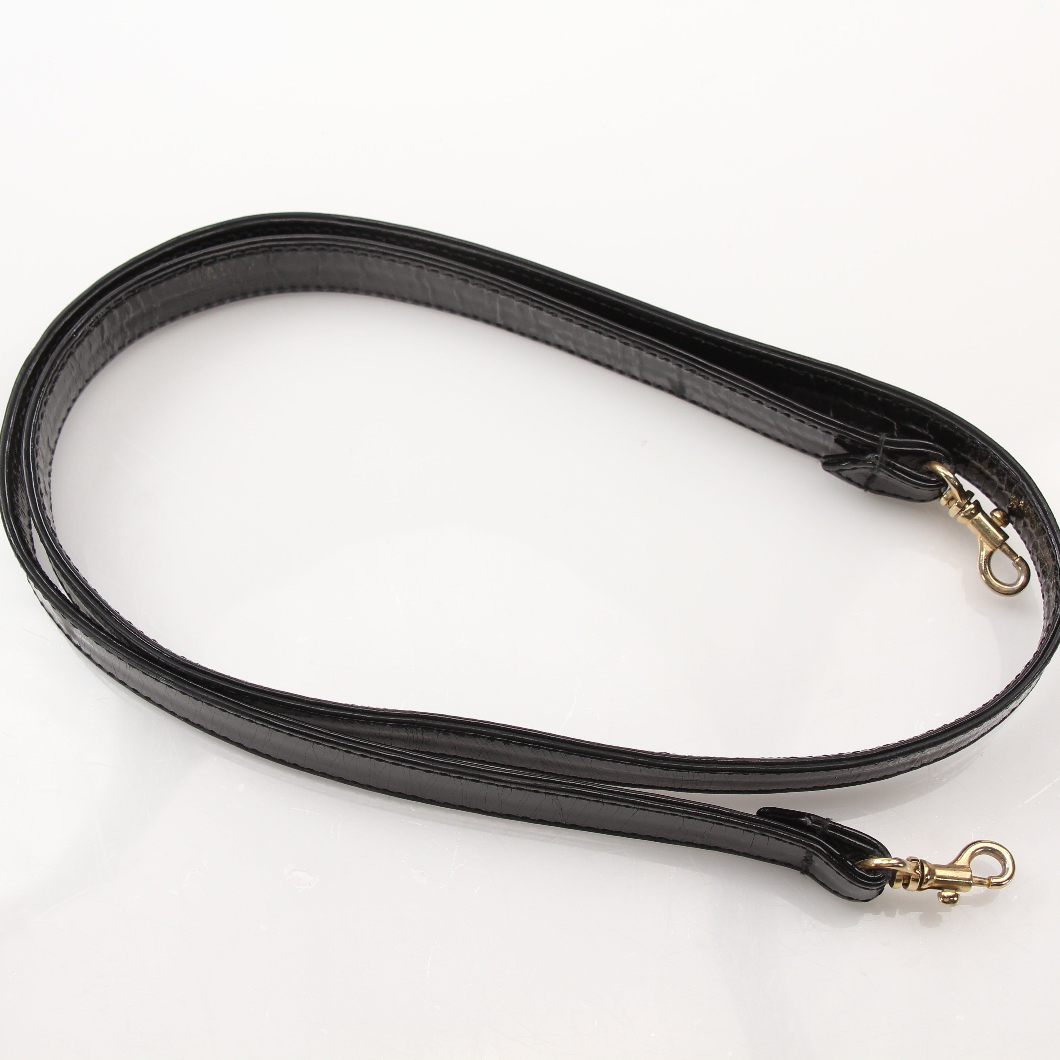 Gold & Beyond Chanel Coco Mark Patent 2-Way Handbag with gold hardware and quilted design, showcasing its luxurious style.