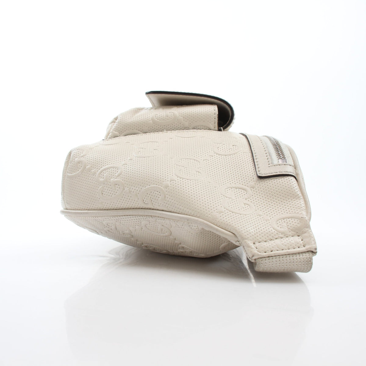 Gucci GG Tennis embossed pocket belt bag in Mystic White, leather handbag with gold accents and adjustable strap.