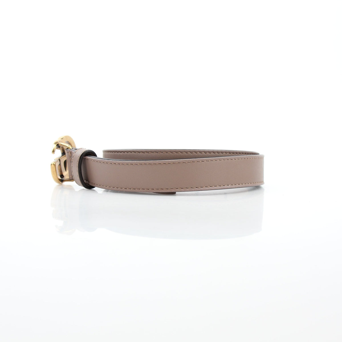 Gucci GG Marmont thin leather belt in taupe, stylish accessories with gold-tone hardware, displayed on a neutral background.