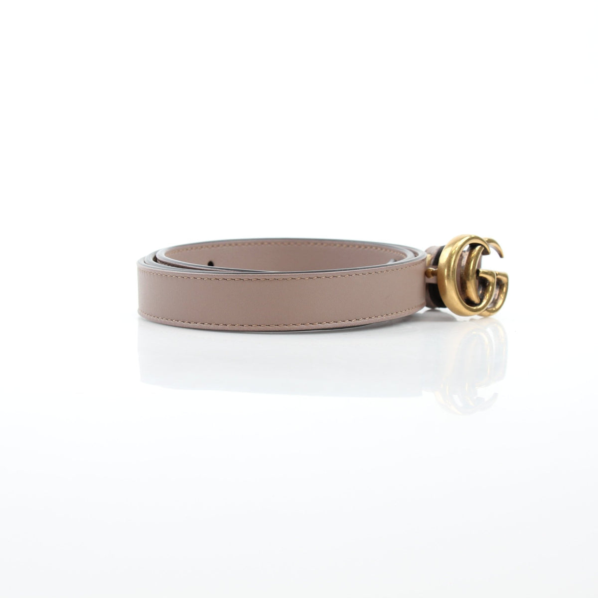 Taupe Gucci GG Marmont thin leather belt with gold buckle, stylish accessory displayed on a neutral background.