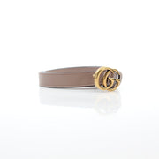 Gold & Beyond Gucci GG Marmont thin taupe leather belt for accessories, featuring the iconic double G logo and sleek design.