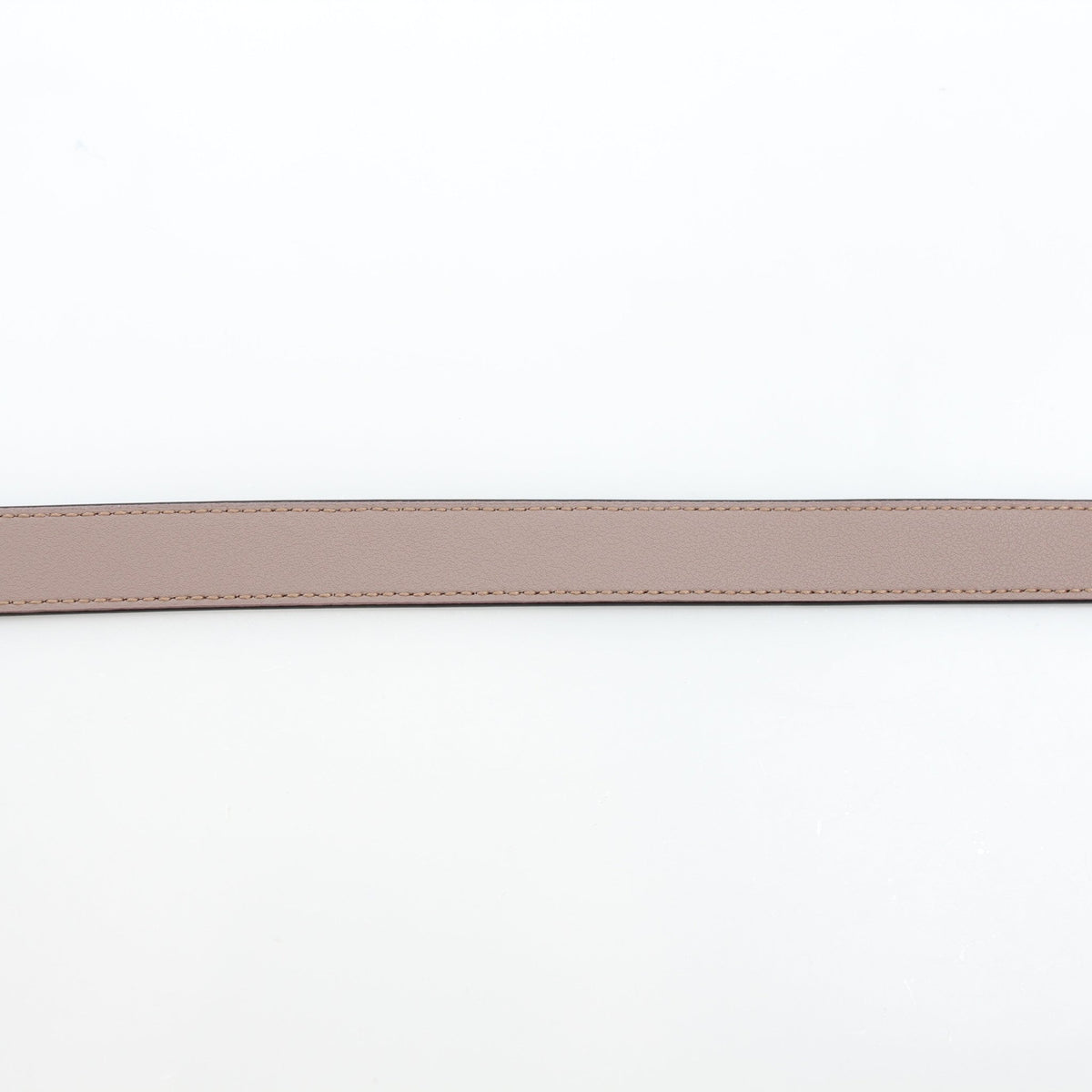 Taupe Gucci GG Marmont thin leather belt with gold-tone buckle, showcasing the designer's signature double G logo.