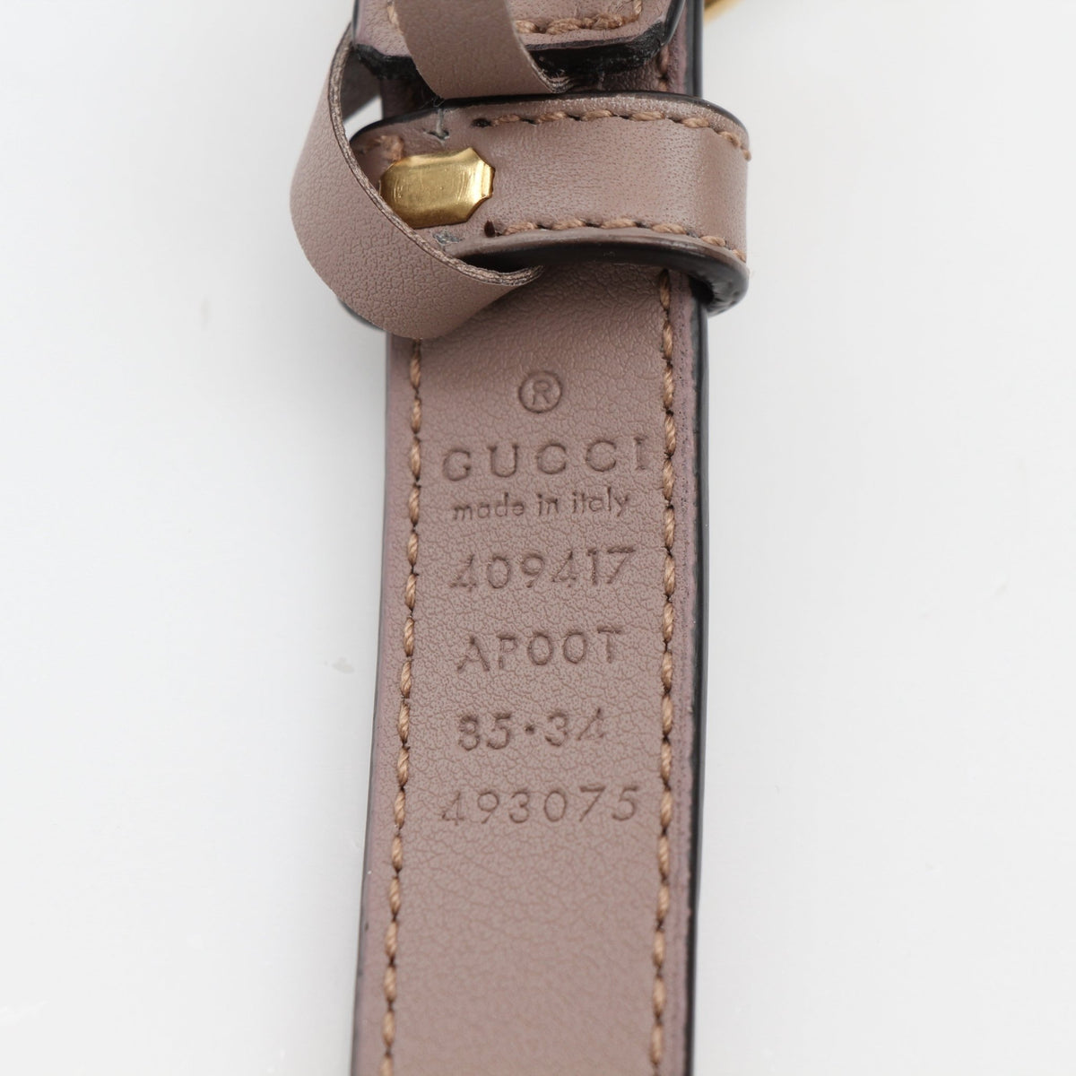 Taupe Gucci GG Marmont thin leather belt with gold hardware, stylish accessories for women.