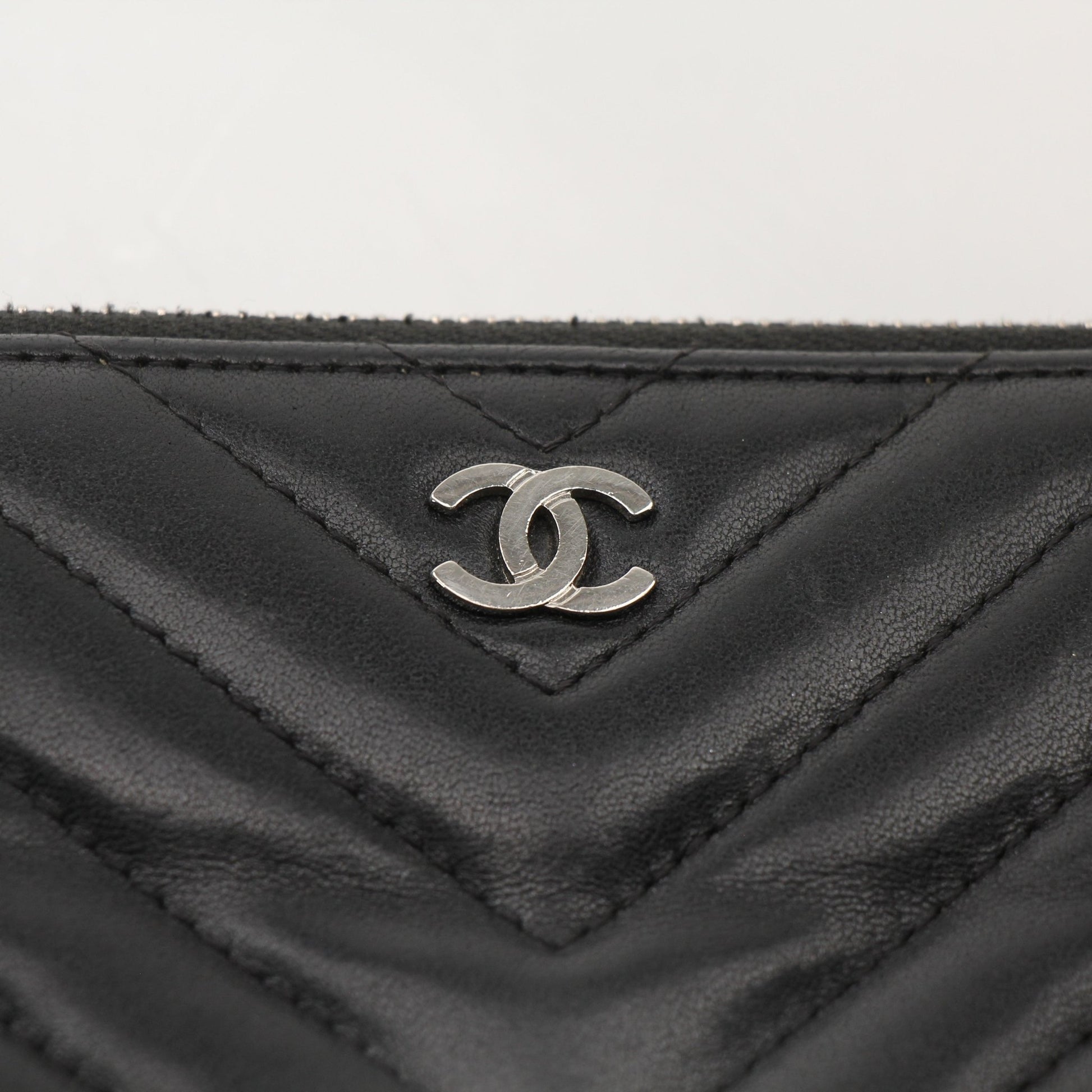 Chanel V-Stitch Chevron Lambskin 2-Way Chain Bag, elegant black handbag with gold chain strap and quilted leather design.