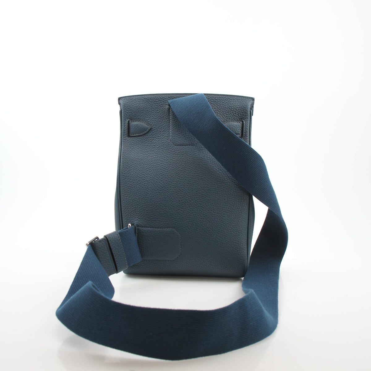 Hermès Hac a Dos PM dark blue Togo calfskin backpack with adjustable straps and gold hardware, shown from the front.