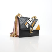 Small Fendi Mania shoulder handbag by Fendi x FILA, featuring a gold-tone chain strap and logo details, stylish and compact.
