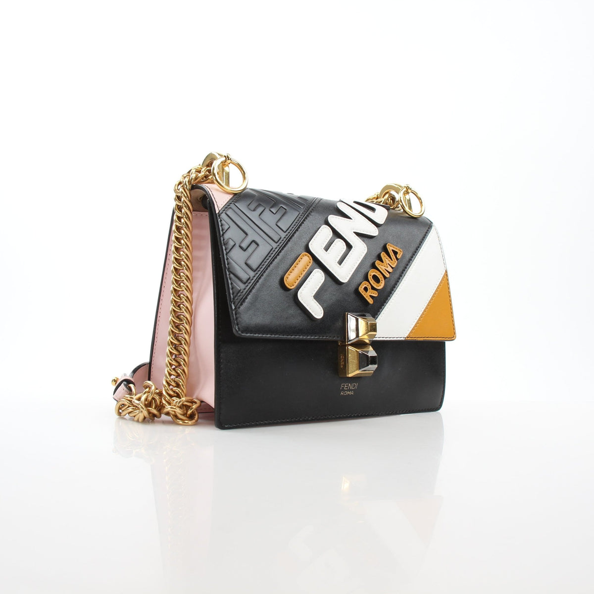 Small Fendi Mania shoulder handbag by Fendi x FILA, featuring a gold-tone chain strap and logo details, stylish and compact.