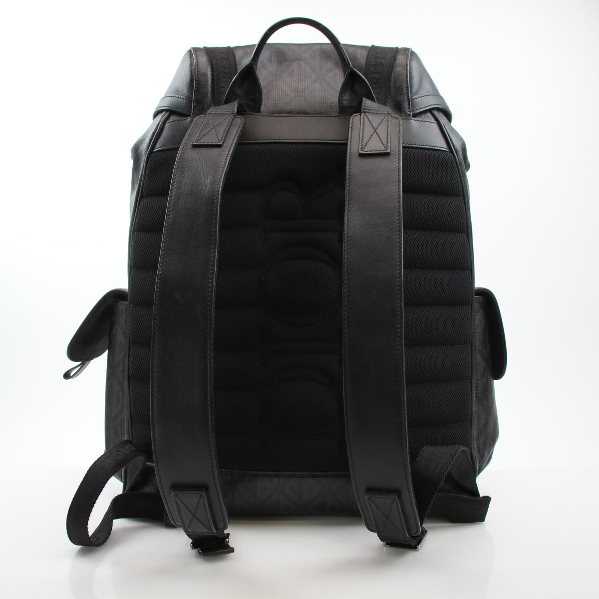 Christian Dior Men’s Hit the Road CD Diamond backpack in black, stylish travel bag with diamond pattern and adjustable straps.