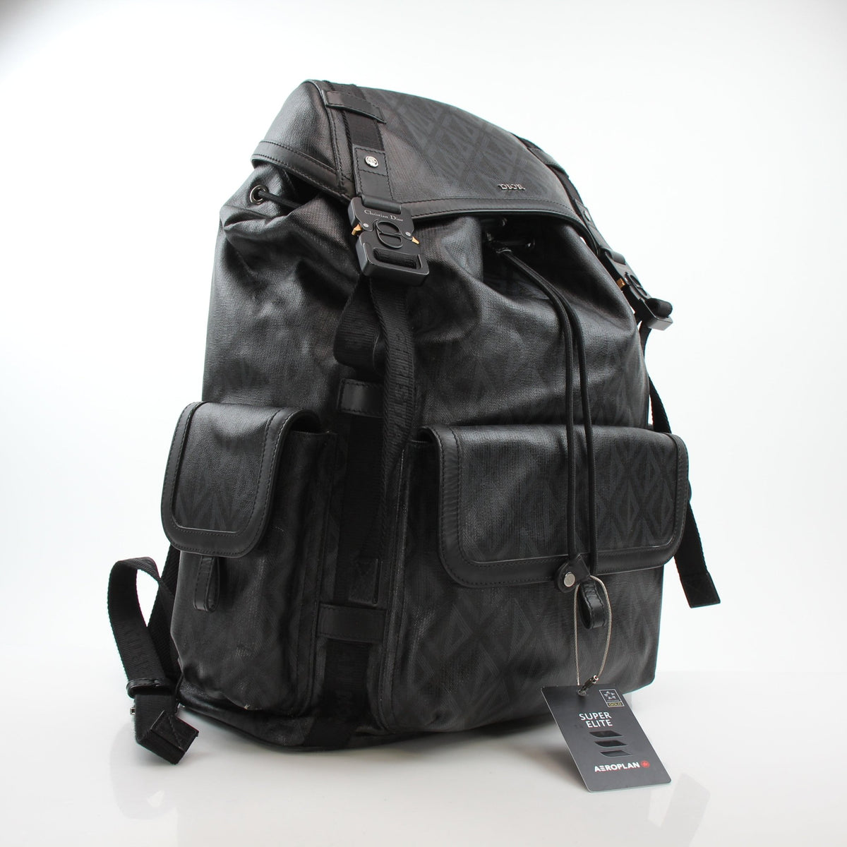 Christian Dior Men’s Hit the Road CD Diamond Backpack in black, designed for travel with stylish, durable leather and gold accents.