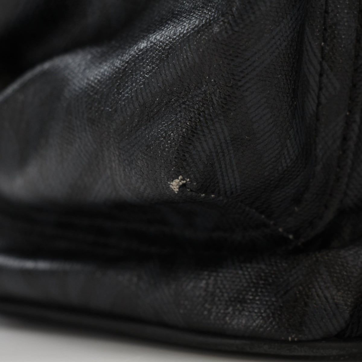 Christian Dior Men’s Hit the Road CD Diamond Backpack in black with adjustable straps and diamond-embossed logo, designed for travel.