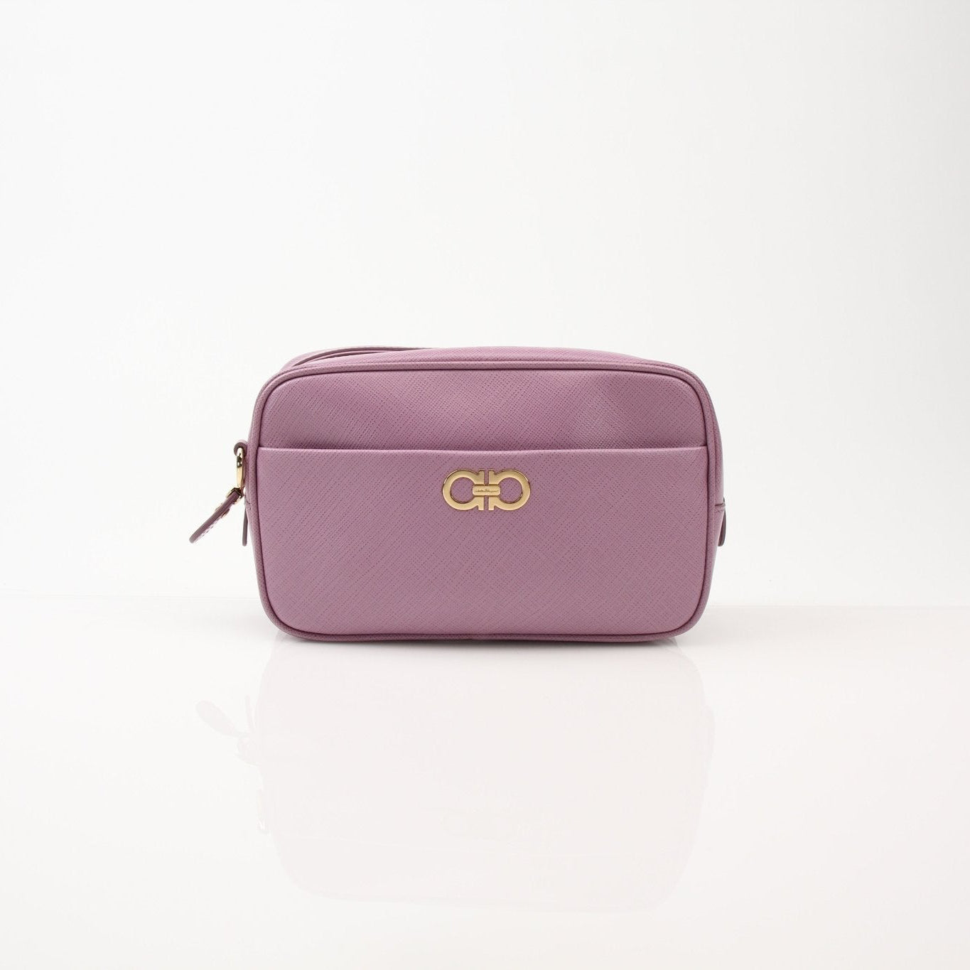 Pink Salvatore Ferragamo Gancini crossbody handbag with gold hardware, featuring a structured design and adjustable strap.