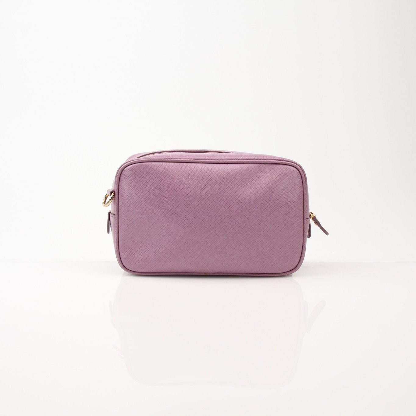 Pink Salvatore Ferragamo Gancini crossbody handbag with gold hardware, featuring a sleek design and adjustable strap.