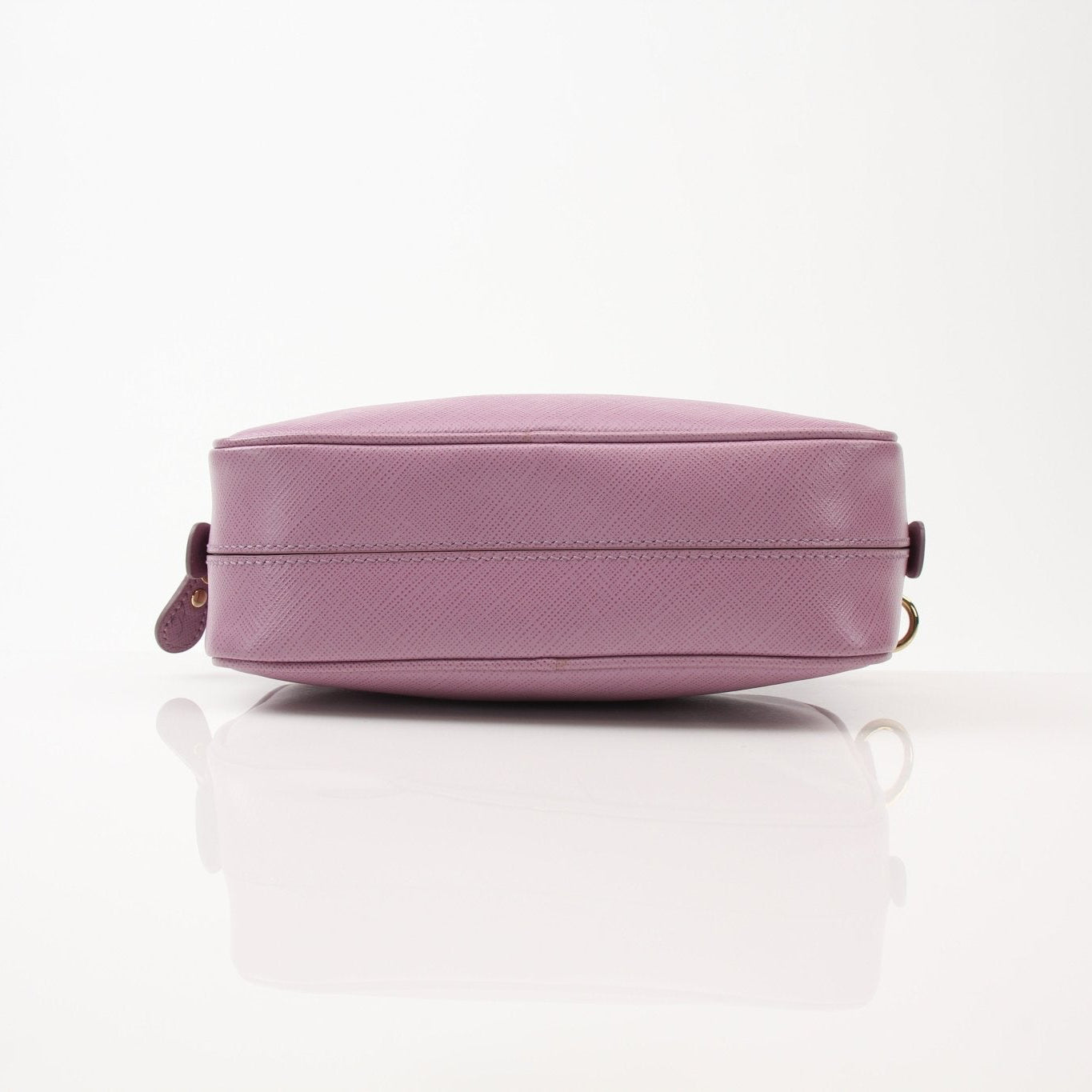 Pink Salvatore Ferragamo Gancini handbag with gold accents, featuring a crossbody strap and elegant design.