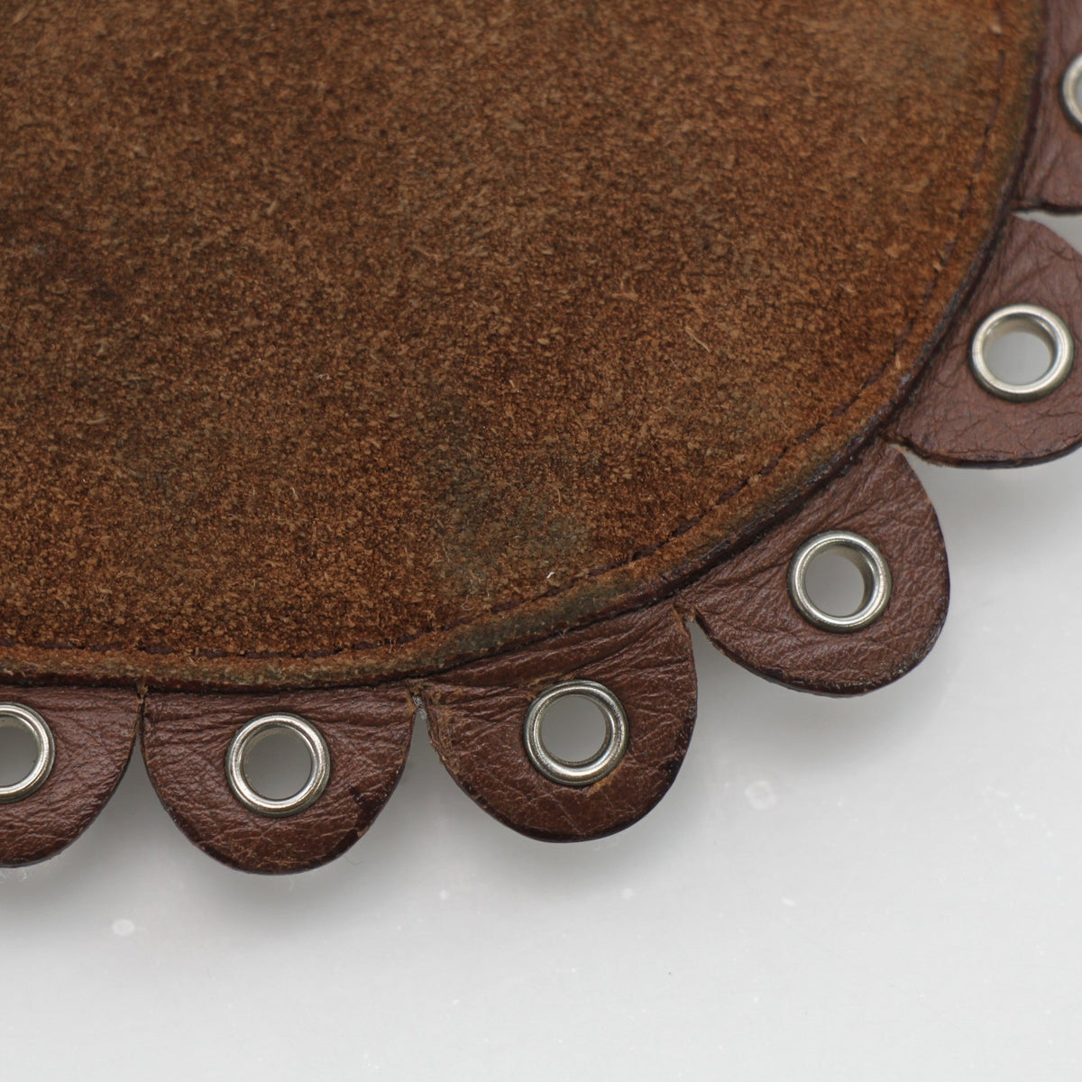 Brown Christian Dior Peace & Love suede clutch handbag with gold accents, featuring a sleek design and textured surface.