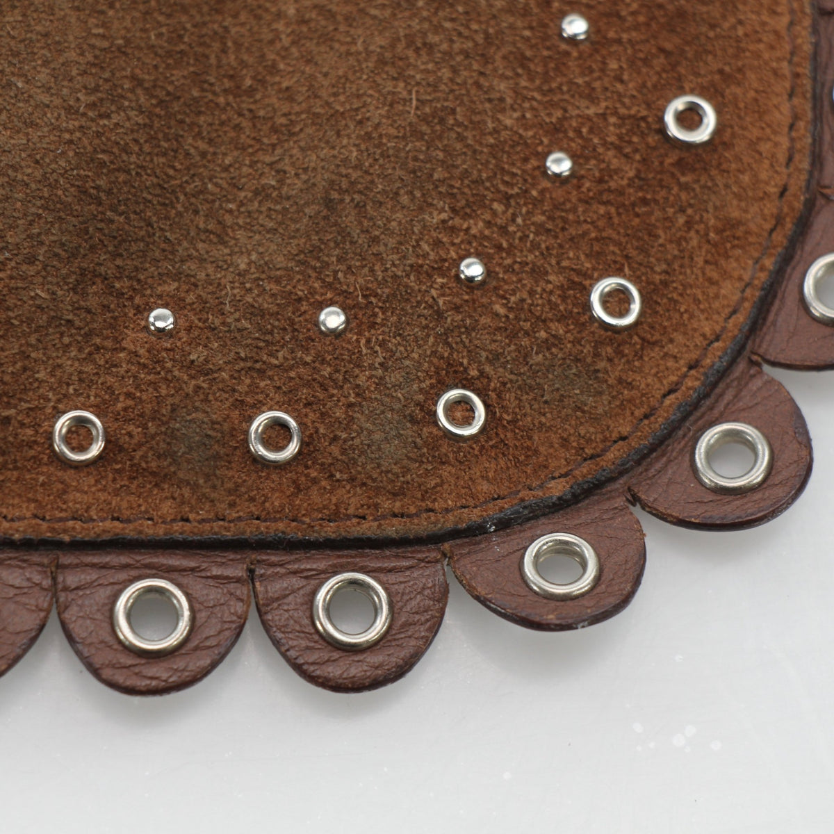Brown Christian Dior Peace & Love suede clutch handbag with gold accents, featuring a sleek, compact design.