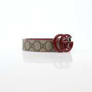 Gucci Double G belt in beige ebony with red accents, featuring gold hardware, displayed on a neutral background.