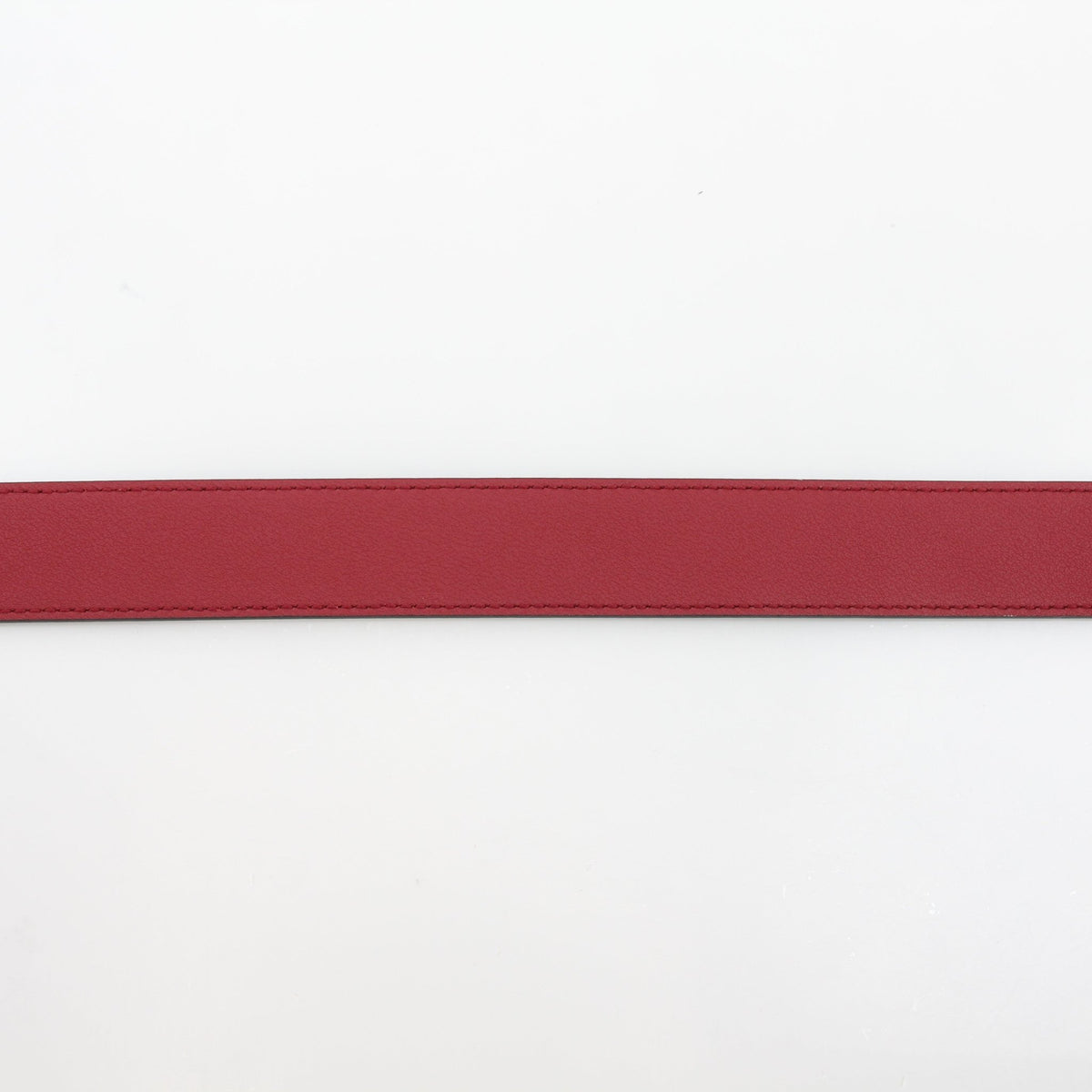 Gucci Double G belt in beige and ebony with red accents, displayed as a stylish accessories piece.