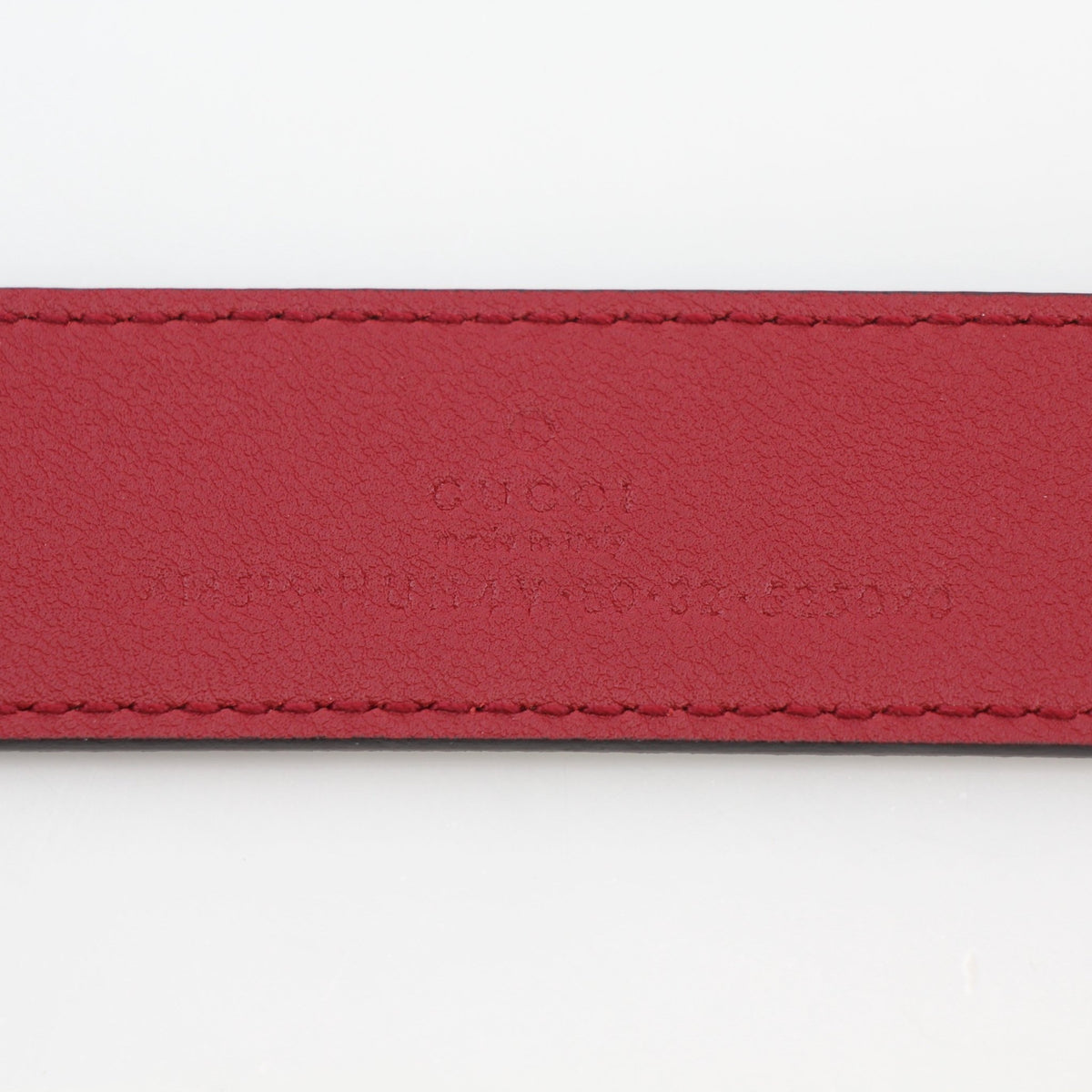 Gucci Double G belt in beige ebony with red accents, stylish accessories featuring the iconic logo design.