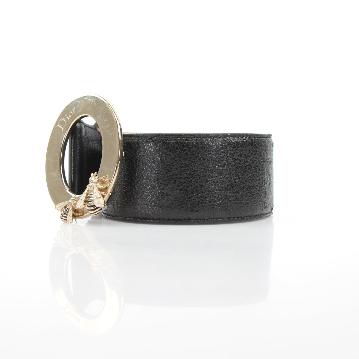 Black grained calfskin leather Christian Dior Cause Bee oval buckle belt handbag with gold accents and elegant design.
