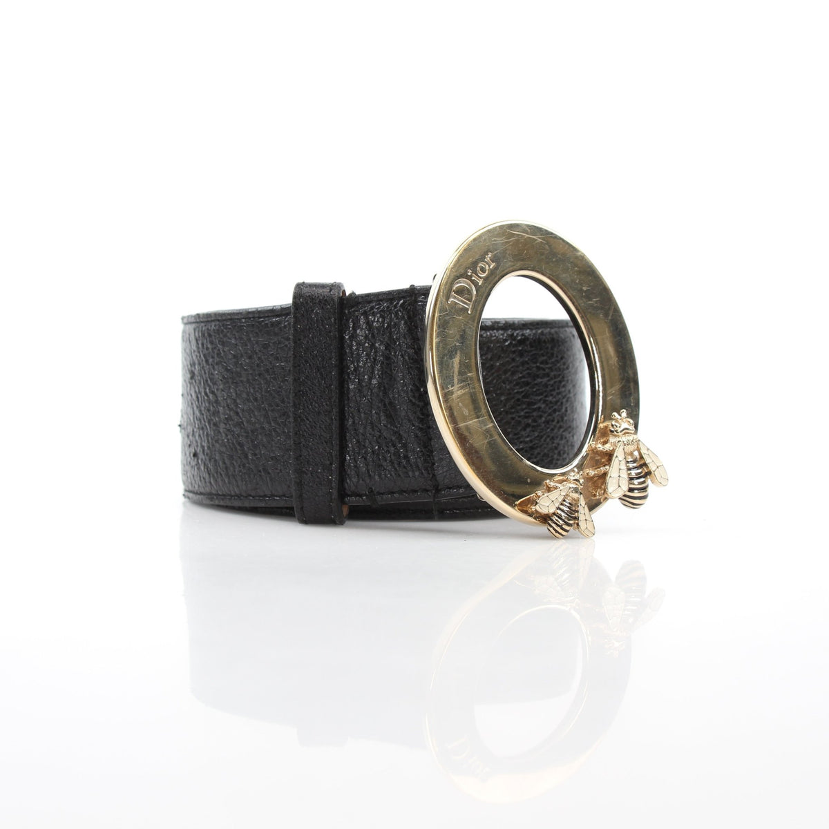 Black Christian Dior Cause Bee oval buckle belt handbag with grained calfskin leather and gold-tone hardware.