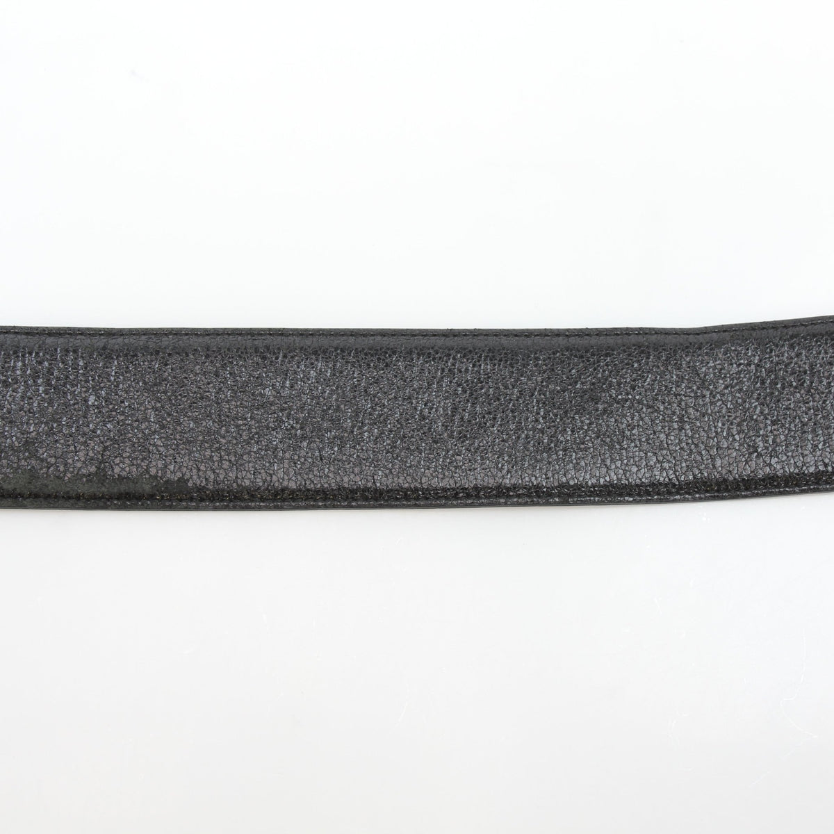 Black Christian Dior Cause Bee Oval Buckle belt made of grained calfskin leather, featuring a distinctive gold bee buckle.
