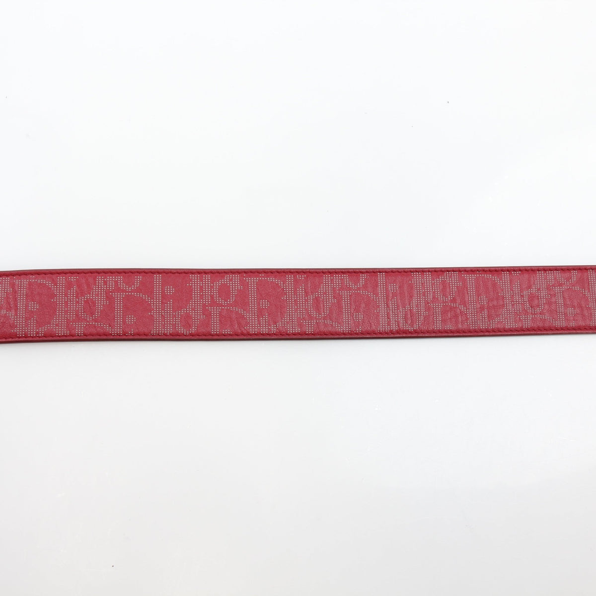 Christian Dior World Tour Oblique Galaxy reversible belt in red calfskin leather, showcasing the designer logo and sleek buckle.