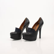 Gold & Beyond Fendi Fendista platform heels with chunky heel and stylish design, shown on a model's feet.