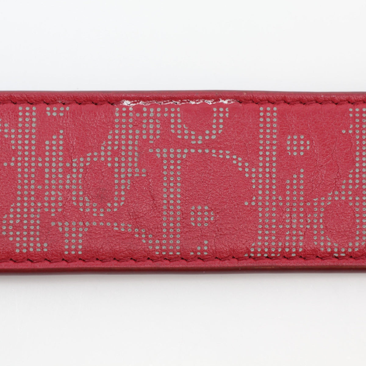 Christian Dior World Tour Oblique Galaxy reversible belt in red calfskin leather with gold accents, featuring a sleek, stylish design.