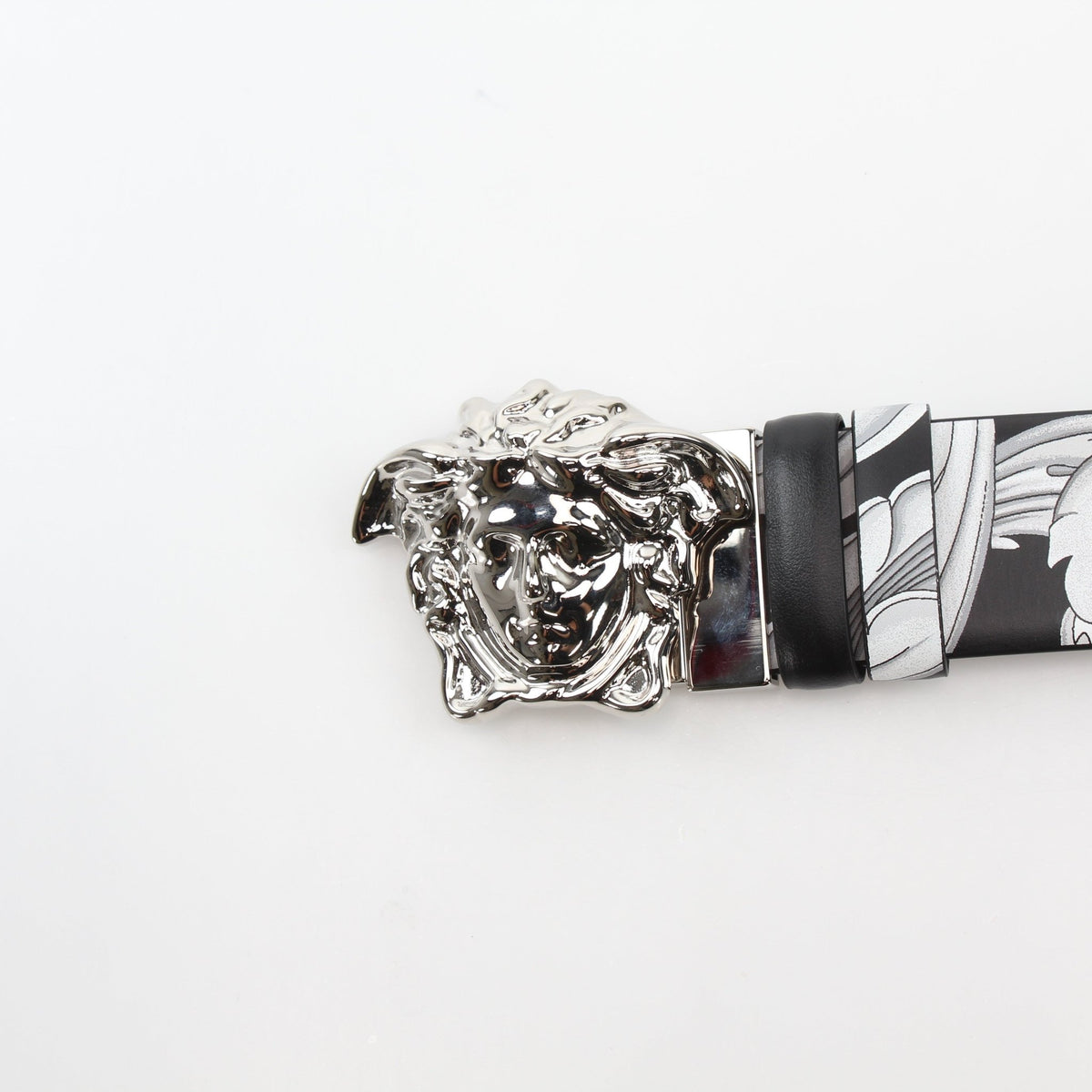 Versace men's Medusa Barocco Istante reversible belt in black and white calfskin leather, showcasing the iconic Medusa design.