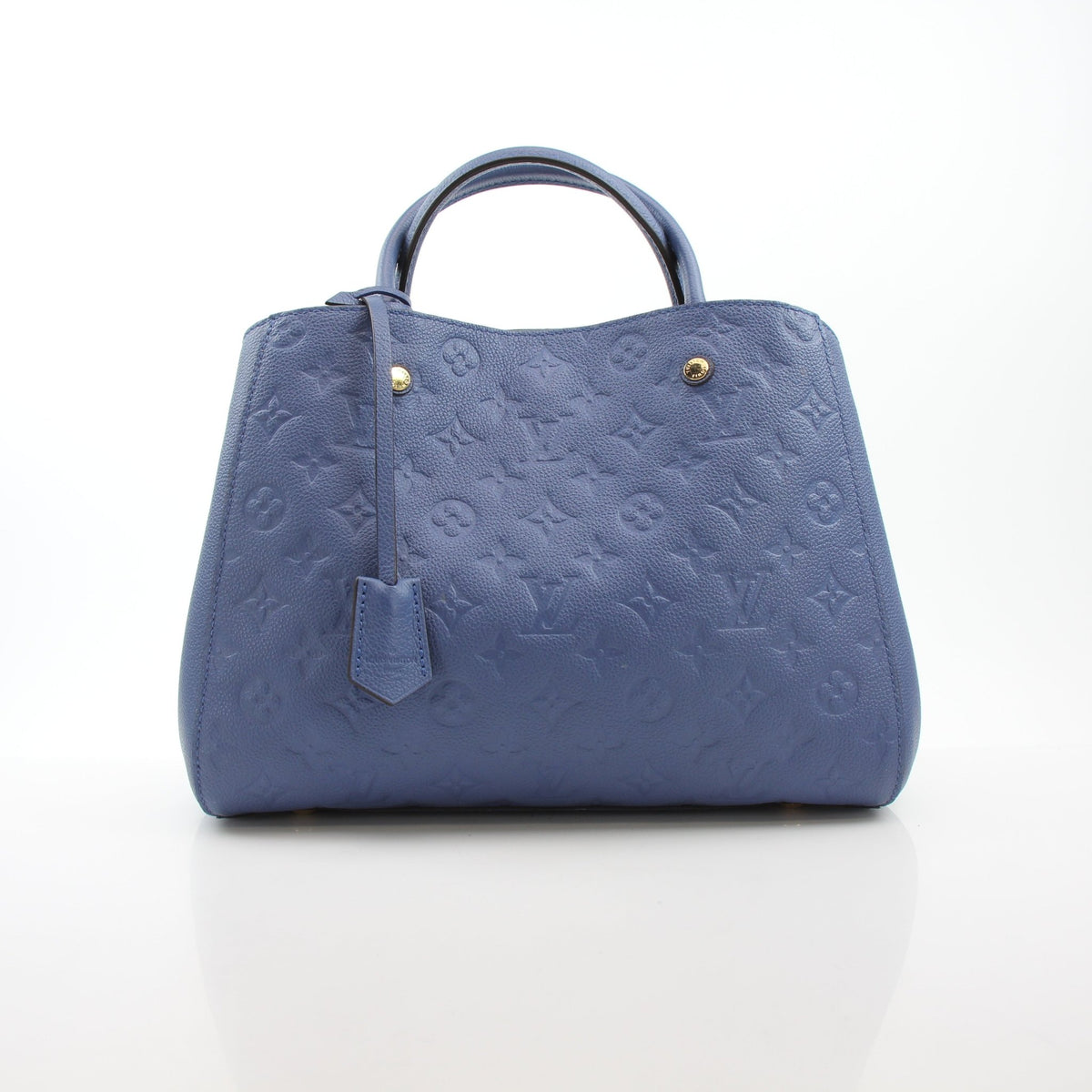 Louis Vuitton Montaigne MM Monogram Empreinte leather handbag in blue with gold hardware, featuring structured design and top handles.