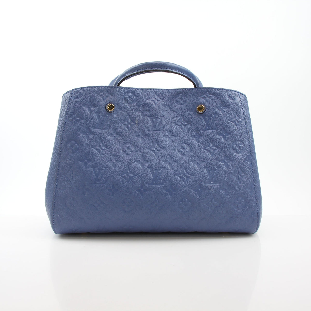 Louis Vuitton Montaigne MM Monogram Empreinte leather handbag in blue with gold hardware, showcasing elegant design and craftsmanship.