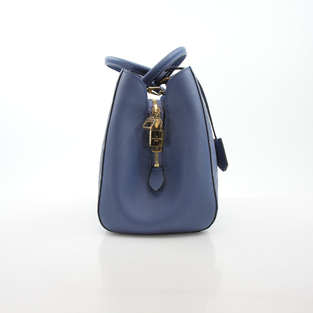 Louis Vuitton Montaigne MM Monogram Empreinte leather handbag in blue with gold hardware, showcasing elegant design and craftsmanship.