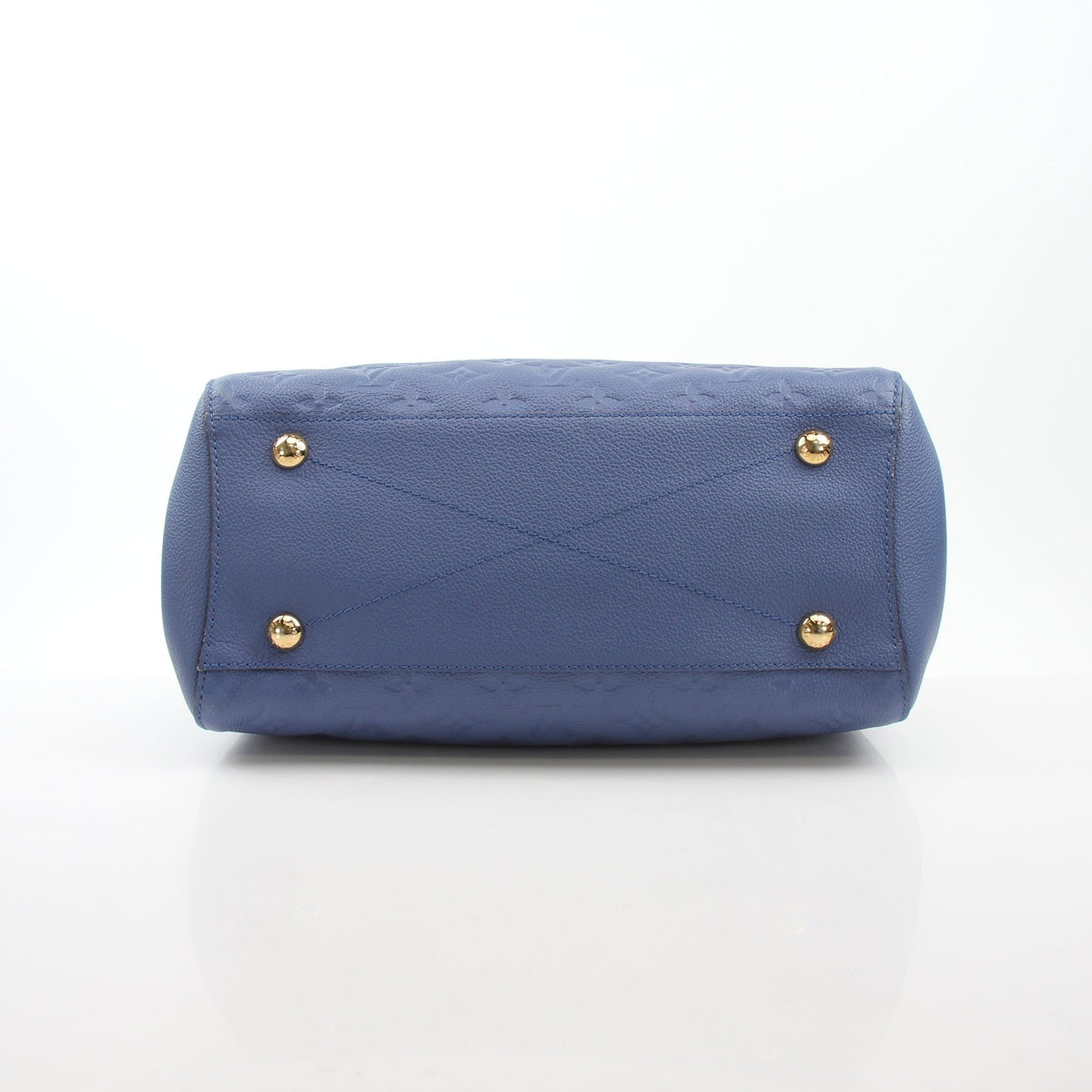 Blue Louis Vuitton Montaigne MM Monogram Empreinte Leather Handbag with gold-tone hardware, featuring structured design and top handles.