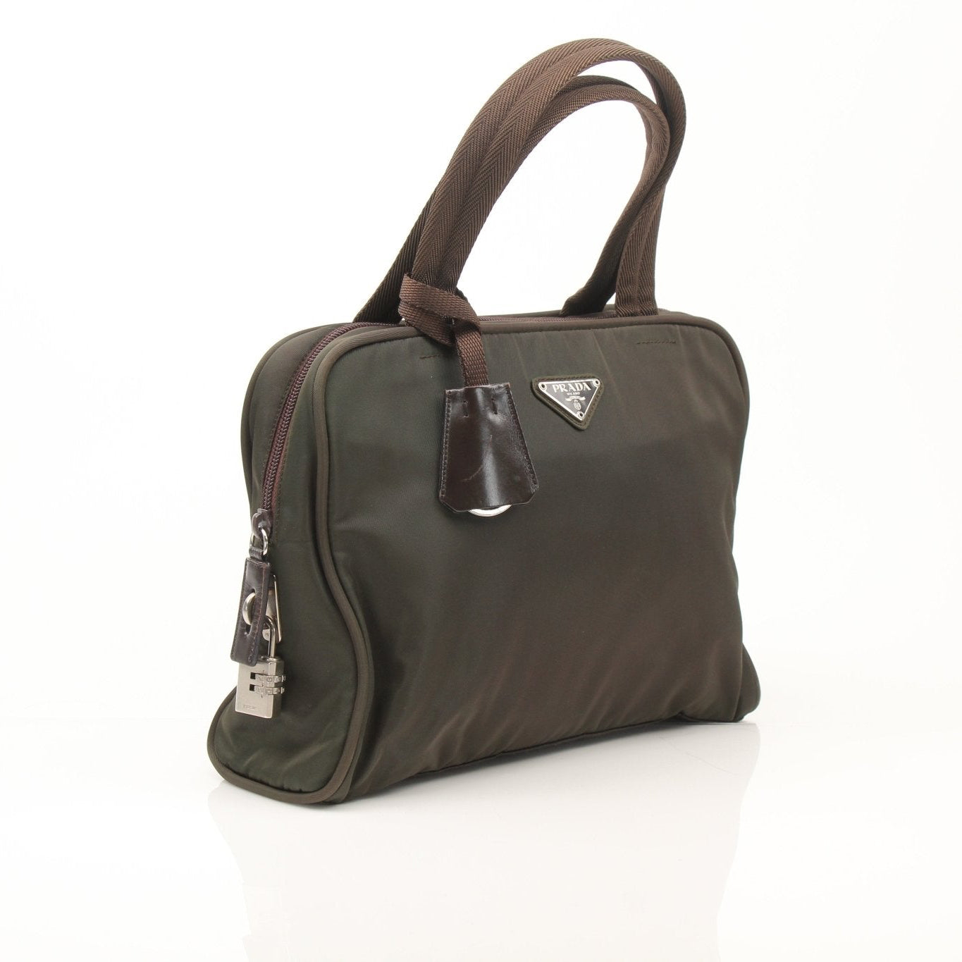 Olive green Prada triangle logo satchel handbag with gold accents and structured design, displayed on a neutral background.