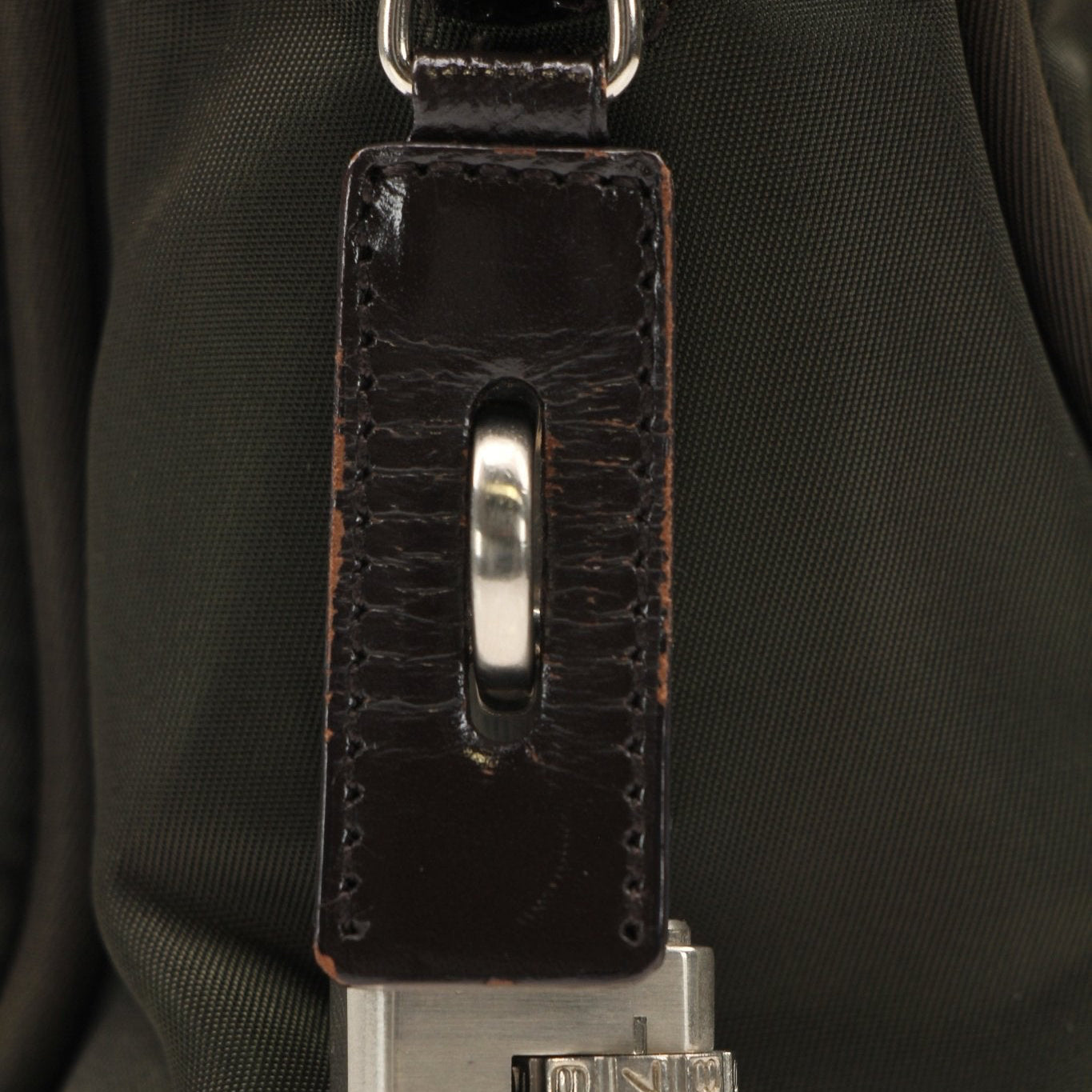 Prada olive triangle logo satchel handbag by Gold & Beyond, featuring a sleek design with a top handle and logo detail.