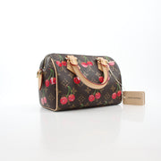 Louis Vuitton x Takashi Murakami Monogram Cerises Speedy Bandoulière 20 handbag with colorful cherry design and gold-tone hardware.