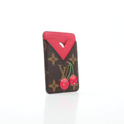 Louis Vuitton x Takashi Murakami Cerises card holder with magnetic closure, featuring colorful cherry blossom design and compact storage.