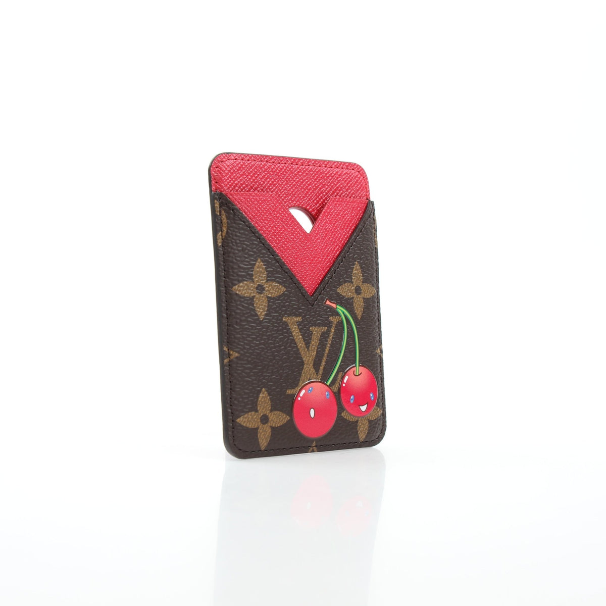 Louis Vuitton x Takashi Murakami Cerises card holder with magnetic closure, featuring colorful cherry blossom design and compact storage.