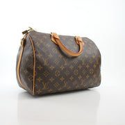 Louis Vuitton Speedy Bandoulière 30 handbag with classic monogram canvas and leather trim, featuring gold-tone hardware.